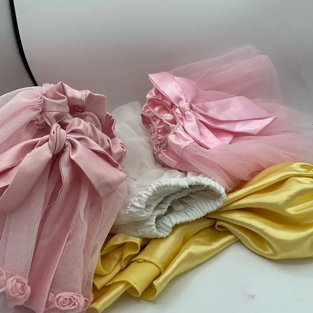 Set of 4 Pink white and Yellow Tutu assorted sizes(2,4,L) but they fit the same